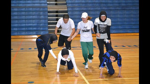 Coaches do team-building activities during a Global Game Changers session.