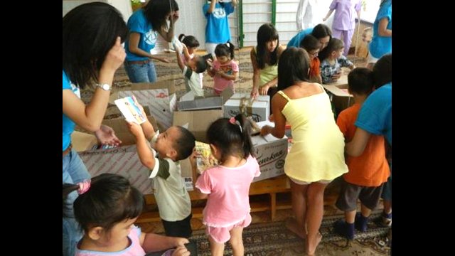 First Place: &quot;After food and books drive at the orphanage!&quot;