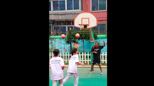 Kiesha Brown leads a shooting drill with girls from the Shenhe Migrant Workers Elementary School in China.