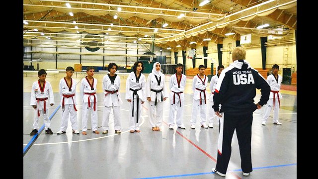 The young Iraqis line up for a clinic with Coach Chuck Thornton at the U.S. Naval Academy.