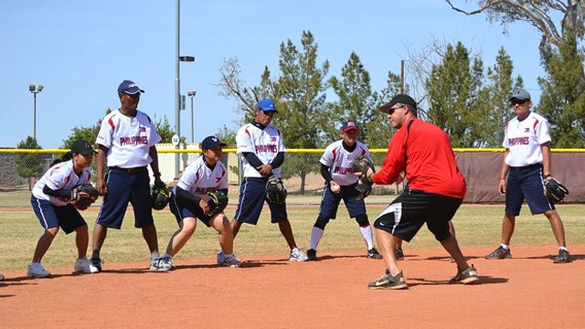 Former Major League Baseball Player Clay Bellinger shows the proper stance for fielding balls.