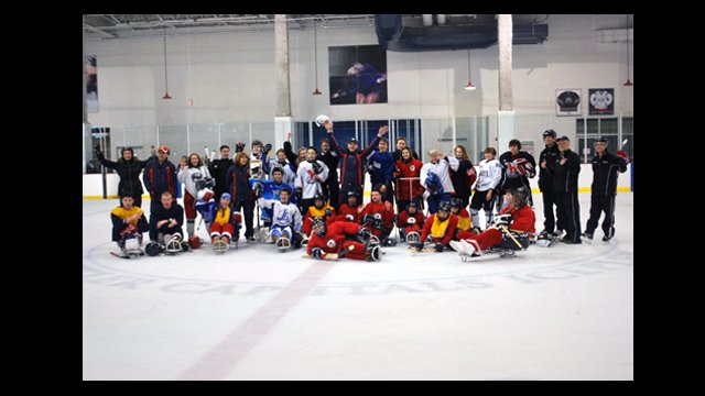     4   The Russian visitors and the hockey sledders pose for a photo after a great scrimmage.