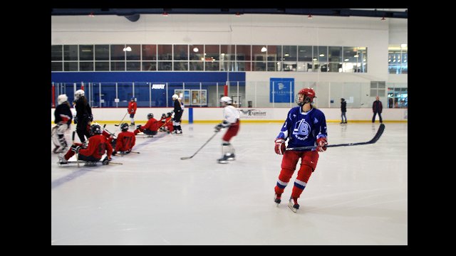 The Russian visitors scrimmage against the sled team.