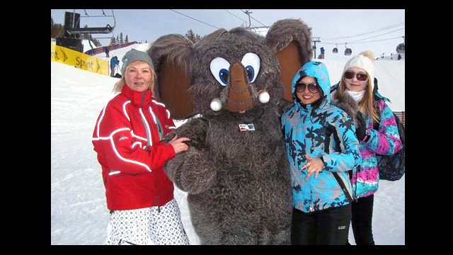 Some of the Sports Visitors greet the Mammoth of Mammoth Mountain during a break from the action at the Slopestyle competition.