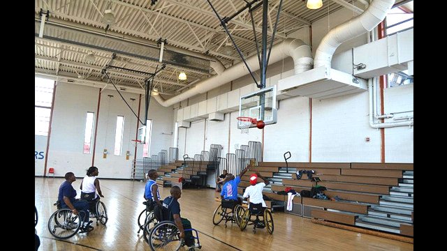 South African basketball players play wheelchair basketball with Mobility International USA.