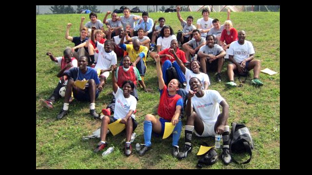 Swaziland coaches and members of the Hylton High School Boys Varsity Soccer Team celebrate with a group photo after a tough workout.