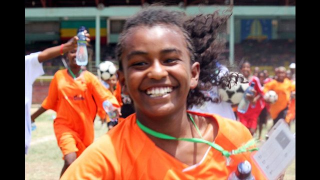 An Ethiopian girl finishes up a warm-up run.