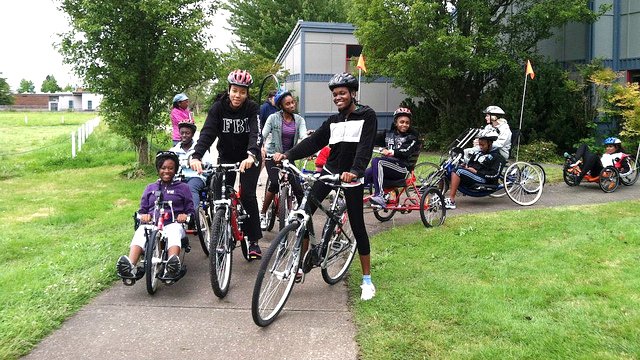 The Caribbean track and field visitors learn about and test out a variety of disability sport bikes at Adaptive Sports in Oregon.