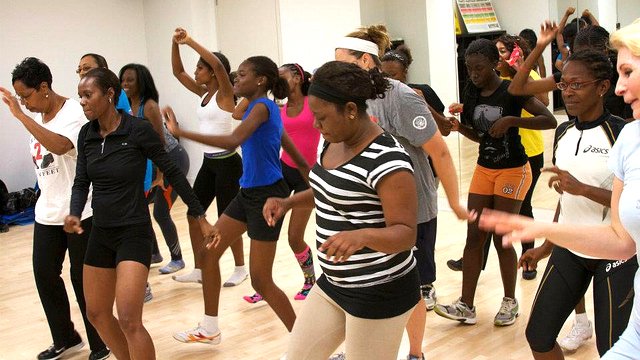 The Caribbean track and field visitors take part in a D.C.-area YWCA line dancing class.