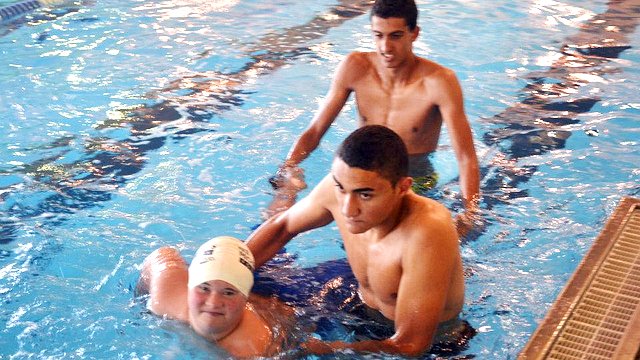 Tunisian participants work with Special Olympics athletes.