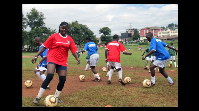 Ugandan soccer coaches practice their dribbling skills at a clinic in Kampala.