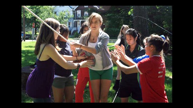 Fiorella, from Bolivia, gets support from her new teammates.