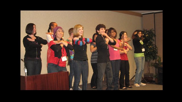 YES Abroad applicants and YES alumni perform the “funky chicken dance” during a talent show.