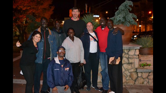 The delegation meets with Gheorghe Muresan, a former NBA player and actor.