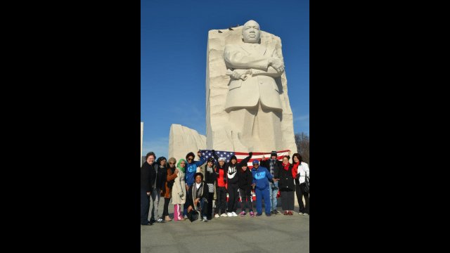 The delegation of coaches from Bahrain, Oman, Qatar, and Yemen group together in front of the Martin Luther King, Jr. monument in Washington, D.C.