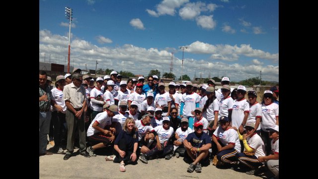 The envoys join in a group photo with Nicaraguan coaches and softball players.