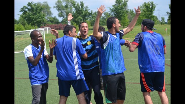 Some of the coaches share their excitement and love of soccer together during a clinic.