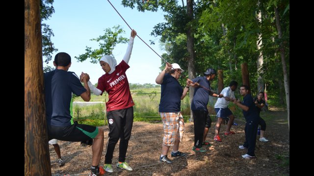 NEA participants worked together to accomplish different challenges at The Edge ropes course. 