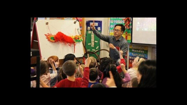 Yu Bo was a Chinese teacher at Arlington High School in Massachusetts during the 2011-2012 school year. He is pictured doing outreach for elementary school children about the Chinese New Year.