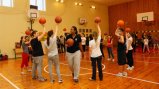 The girls basketball team works with Tamika Raymond on drills and skills.