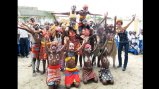 Carmen Smith poses with school children in the Democratic Republic of Congo who performed for her visit.