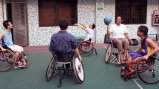 Dr. Woodson-Smith plays wheelchair basketball with some of the students at Guangzhou English Training Center (GETCH).