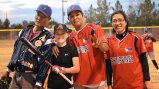 The Filipino coaches pose with young American athletes.