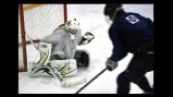 A Russian visitor tries to deke a Washington Pride goalie.