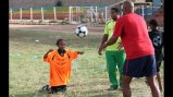 Tony Sanneh works on header techniques with a young Ethiopian.