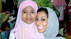 Lynn ElHarake, Fulbright English Teaching Assistants (ETA) to Malaysia, February 2011, with a student at The Muslim Girls' Fashion Club charity show in Terengganu.