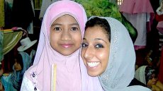 Lynn ElHarake, Fulbright English Teaching Assistants (ETA) to Malaysia, February 2011, with a student at The Muslim Girls' Fashion Club charity show in Terengganu.