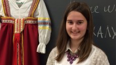 Liza, a FLEX exchange student from Russia, poses with a traditional Russian outfit.