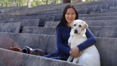 Fulbright Foreign Student alumna Uyanga Erdenebold with her seeing-eye dog, Gladys.