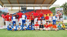 Group shot before a baseball clinic with Sports Envoys Barry Larkin and Joe Logan in Ecuador.