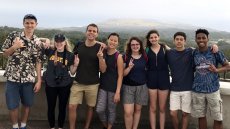 Group of teens and young adults with large mountain in background