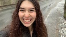 Selfie of Chloe standing on a road