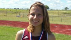 Close up of girl standing on track field