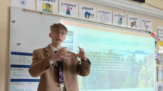 Laurence delivering a presentation on Germany to his classmates.