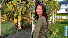 Image of Leni standing among plants