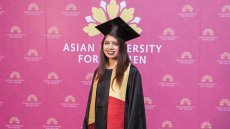 Young woman wearing cap and gown