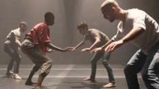 Dancers standing and facing each other