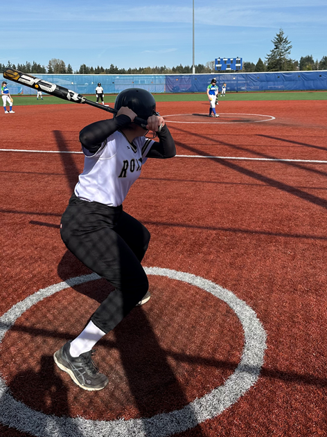 Tuana prepares to take a swing at a softball game.